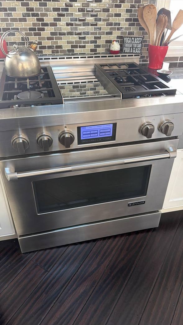 Jenn-Air professional range with griddle and touchscreen display in a New York City kitchen